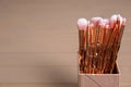 Organizer with professional makeup brushes on wooden table Royalty Free Stock Photo