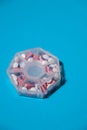 Organizer weekly shots on blue background with Copy space for your text. Closeup of medical pill box with doses of