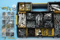 Organizers with many different fasteners and wrenches on light blue wooden table, flat lay Royalty Free Stock Photo