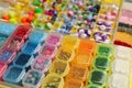 Organizers with variety of colorful beads as background