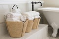 organizing and storage solutions using containers, hooks, and baskets for the bathroom