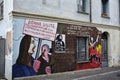 Main street in historic center of Orgosolo decorated by local artists wall paintings,