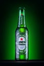 Orhei, Moldova - June 4, 2020 : Bottle of Heineken Lager Beer on green background. Heineken is the flagship product of Heineken Royalty Free Stock Photo