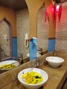 Turkish style bathroom and yellow sticker in sink about keeping social distance