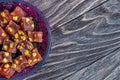 Oriental Arabian sweets with different nuts. Eastern sweets. Traditional Turkish delight Rahat lokum on a wooden background.