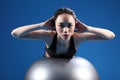 Oriental Asian woman back stretch on exercise ball Royalty Free Stock Photo