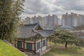Oriental building with highrise apartments in background Royalty Free Stock Photo