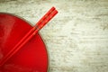 Oriental ceramic plate and chopsticks in red Royalty Free Stock Photo