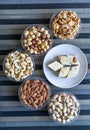 Oriental dessert halva with pistachio, almond, cashew nuts, peanut, walnut  on a  plate. Image. Healthy food. Nuts mix assortment Royalty Free Stock Photo