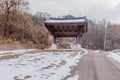 Oriental gate beside rural mountain road