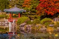 Oriental gazebo next to pond