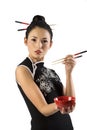 Oriental girl with chopstick