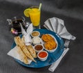 Oriental Indian set, naan bread and onion bhaji, four sauces, b