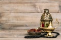 Oriental lamp and dates Arabic still life with rosary