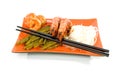 Oriental meal on orange plate Royalty Free Stock Photo