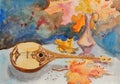 Oriental musical instrument lies on the table among the autumn maple leaves. watercolor painting