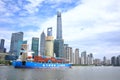 Oriental Pearl TV Tower Shanghai Bund buildings and large container ships on Huangpu River