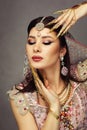 oriental princess close up with finger metal nails Royalty Free Stock Photo