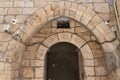 Oriental scenery carved in stone above the entrance on Shaar Shalshelet Street in the Arab Quarter in the old city of Jerusalem,