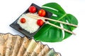 Oriental set of rice, tomatoes, chopsticks, green leaf and trans Royalty Free Stock Photo
