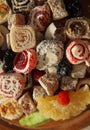 Oriental Sweets. Close up of Turkish delight and succades on wooden plate. Top view. Dessert background Royalty Free Stock Photo