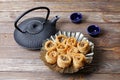 Oriental sweets, teapot and two bowls