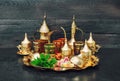Oriental tea table golden dishes delight mint decoration