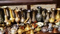 Oriental, Turkish, Azerbaijani antique collection of antique bronze tableware, brass bowl, jugs, spoons, forks, knives on display Royalty Free Stock Photo