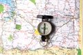 An orientation compass rest on a geographic map and copy space for your text Royalty Free Stock Photo