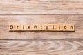 Orientation word written on wood block. Orientation text on wooden table for your desing, concept Royalty Free Stock Photo