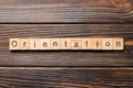 Orientation word written on wood block. Orientation text on wooden table for your desing, concept Royalty Free Stock Photo