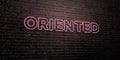ORIENTED -Realistic Neon Sign on Brick Wall background - 3D rendered royalty free stock image