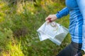 Orienteering athlete running through a summer forest with a map and compass. Royalty Free Stock Photo