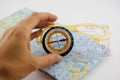 Orienteering Compass and Map with hand. Compass on map