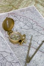 Orienteering: compass on maps Royalty Free Stock Photo