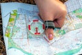 Orienteering. Compass and topographic map. The athlete uses navigation equipment for orienteering. The concept.