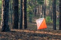 Orienteering. Control point Prism and composter for orienteering in the autumn forest. The concept.