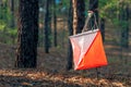 Orienteering. Control point Prism and composter for orienteering in the autumn forest. The concept. Royalty Free Stock Photo