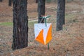 Orienteering. Control point Prism and composter for orienteering in the autumn forest