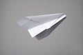 Origami airplane made of checkered notebook paper