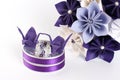 Origami artificial wedding paper bouquet - purple and white flowers with beads, and ring box decorated with origami birds and bead Royalty Free Stock Photo