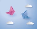 Origami birds on blue background with cloud