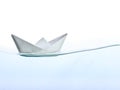 Origami boat on water