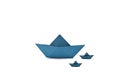 Origami boats, floating boats, sailing ships, paper boats, three blue floating boats isolated on white background Royalty Free Stock Photo