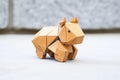 origami burr puzzle made out of brown paper on marble surface