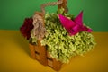 Origami butterfly on a green bush in a basket on a colored background beautiful bouquet studio closeup shot handmade
