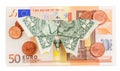 Origami butterfly sits on 50 euro banknote with coins isolated