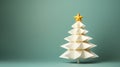 Origami christmas tree on green pastel background