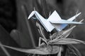 Origami crane in plant nature setting Royalty Free Stock Photo
