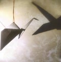 Origami crane with shadow. Nice abstract background Royalty Free Stock Photo